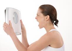 frustrated woman wanting to lose weight